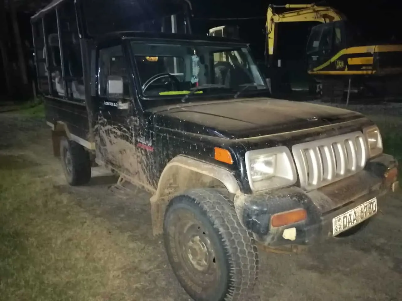 A safari jeep waiting in the dark before an early pickup